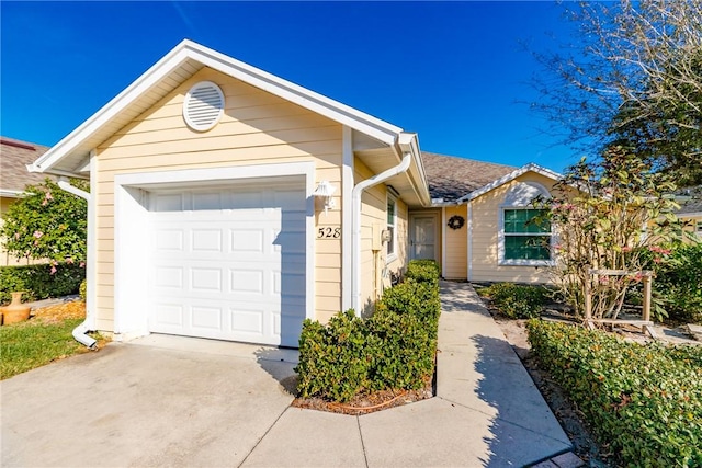 ranch-style home featuring a garage