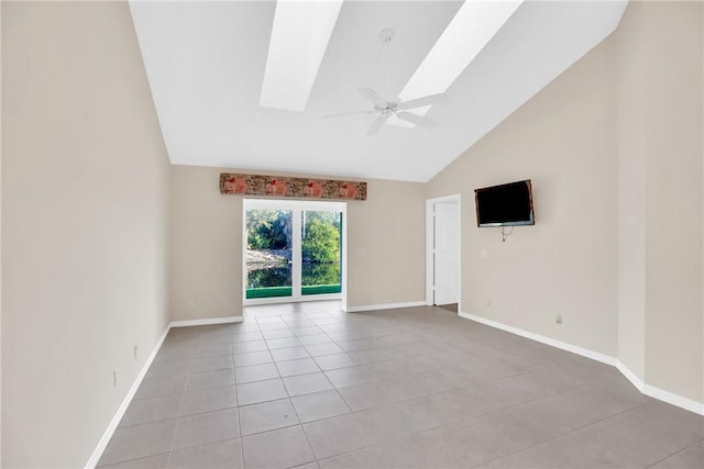 unfurnished room featuring light tile patterned flooring, high vaulted ceiling, ceiling fan, and a skylight