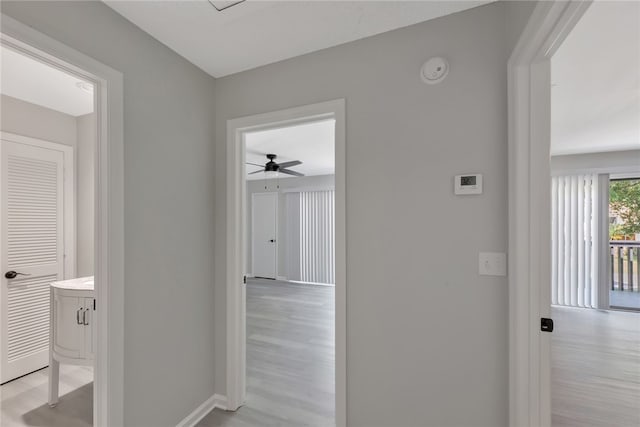 corridor with light wood-type flooring