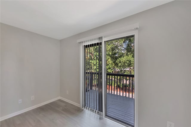 unfurnished room with light hardwood / wood-style flooring