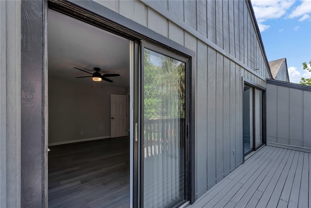 exterior space featuring a wooden deck and ceiling fan