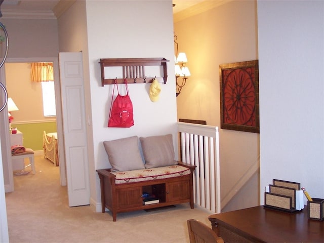 interior space featuring ornamental molding and light colored carpet