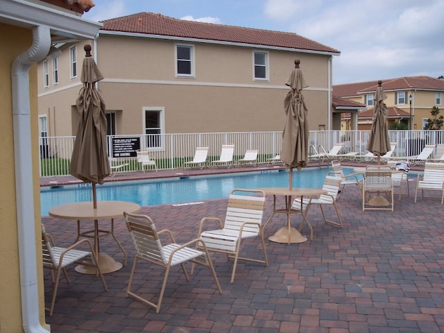 view of swimming pool featuring a patio