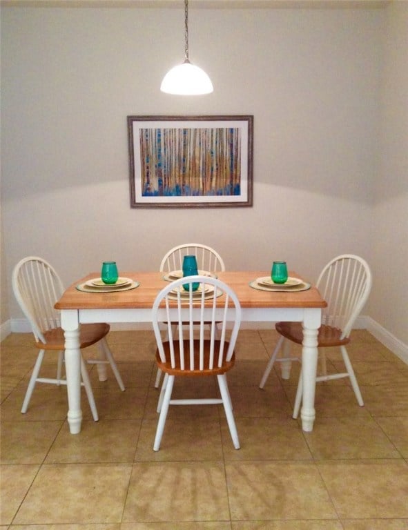 dining space with light tile patterned flooring