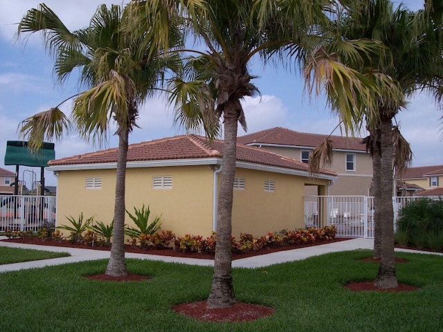 view of home's exterior with a yard