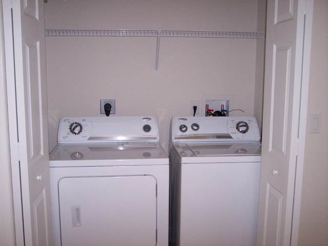 washroom with separate washer and dryer