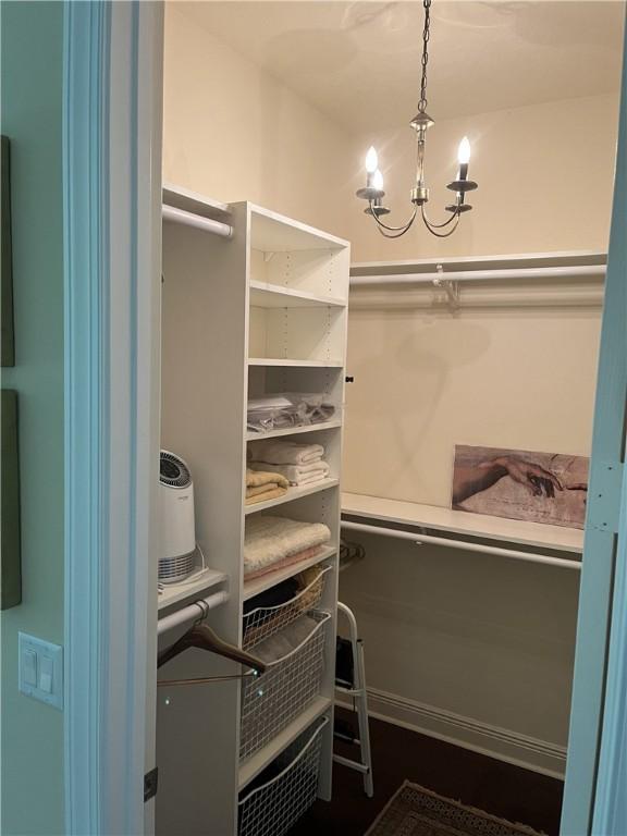 7633 Fieldstone Ranch Sq, Vero Beach, FL 32967 - spacious closet with a chandelier