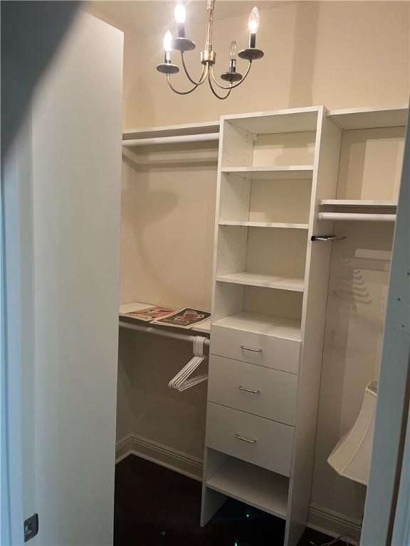 7633 Fieldstone Ranch Sq, Vero Beach, FL 32967 - walk in closet featuring a chandelier