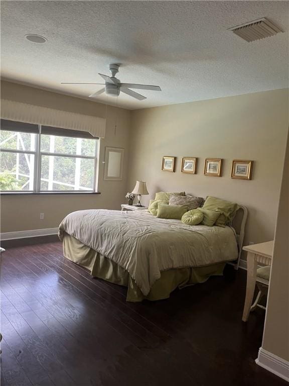7633 Fieldstone Ranch Sq, Vero Beach, FL 32967 - bedroom with a textured ceiling, hardwood / wood-style flooring, and ceiling fan