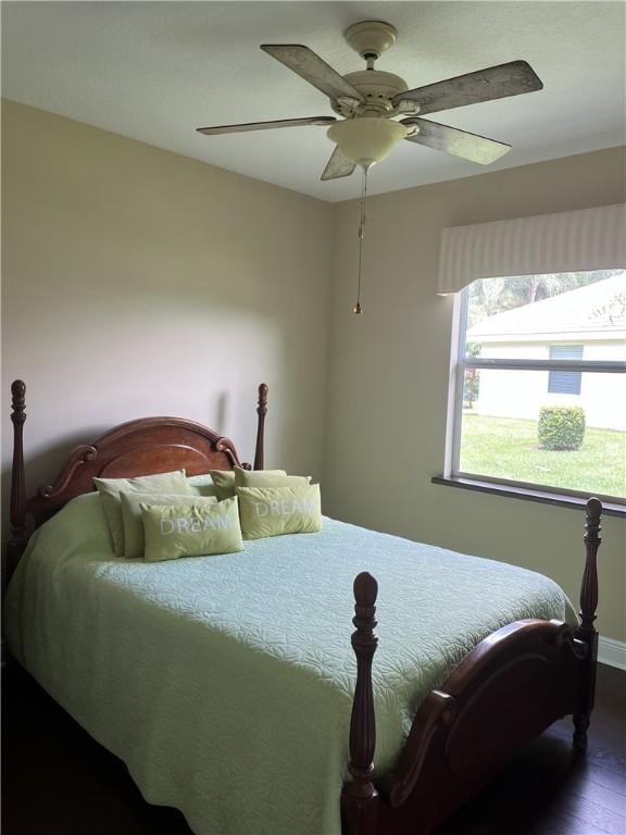 7633 Fieldstone Ranch Sq, Vero Beach, FL 32967 - bedroom with wood finished floors and a ceiling fan