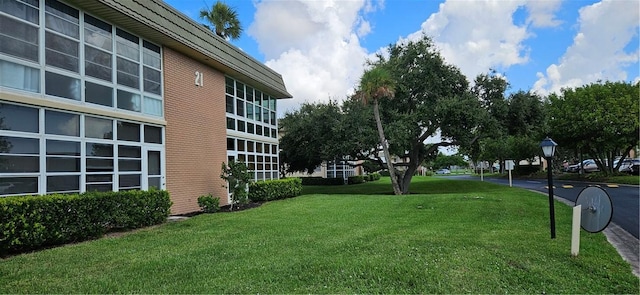 view of property's community with a yard