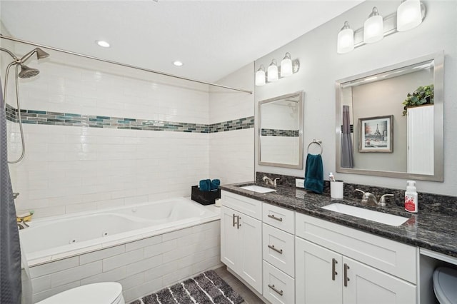 full bathroom with toilet, vanity, and tiled shower / bath combo