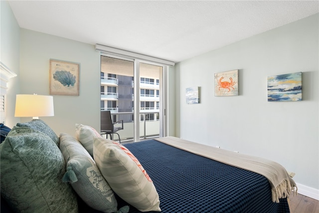 bedroom with hardwood / wood-style floors