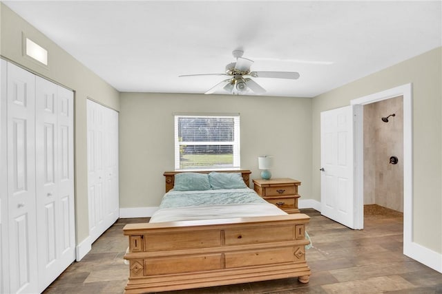 bedroom with multiple closets, hardwood / wood-style floors, and ceiling fan