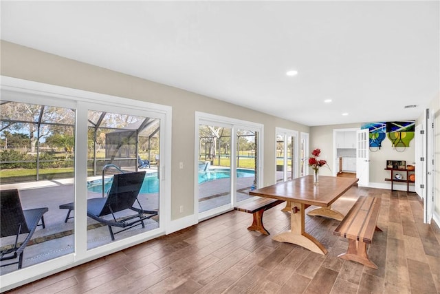 dining room featuring french doors and dark hardwood / wood-style flooring