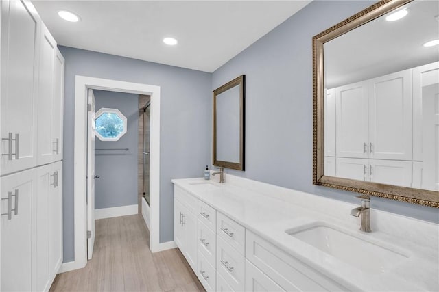 bathroom with vanity and hardwood / wood-style floors