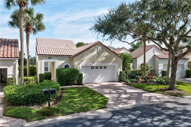 mediterranean / spanish house featuring a garage