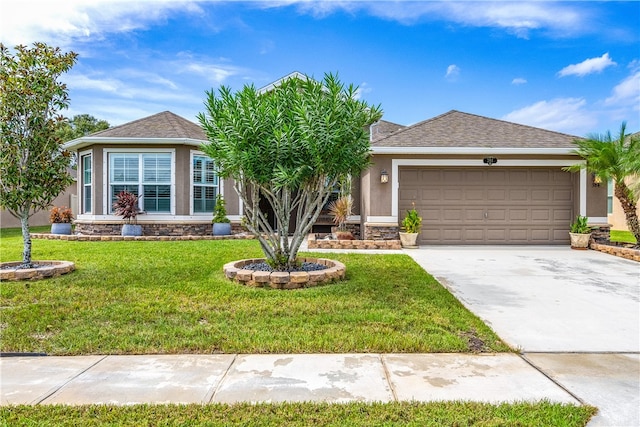 view of front of house featuring a front yard and a garage