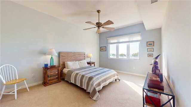 bedroom featuring light colored carpet and ceiling fan