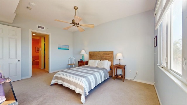 bedroom with light colored carpet and ceiling fan