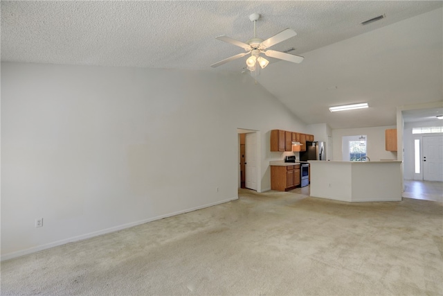 unfurnished living room with lofted ceiling, light carpet, and ceiling fan