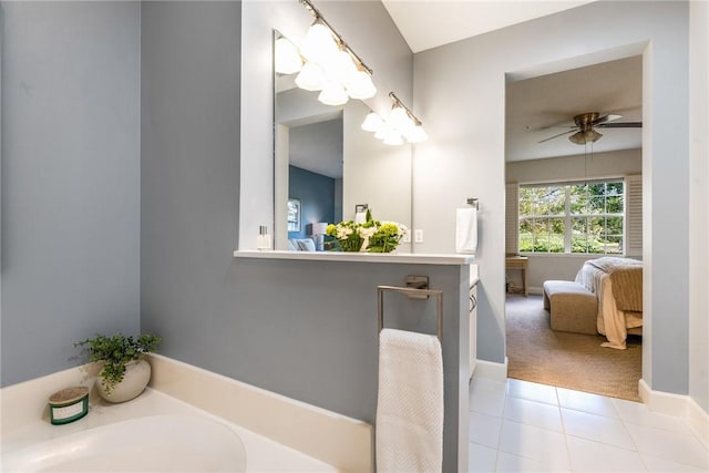 bathroom featuring tile patterned floors, ceiling fan, and a bathing tub