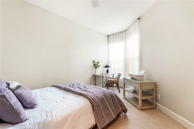 bedroom featuring ceiling fan and carpet floors