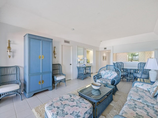 living room with light tile patterned floors and visible vents