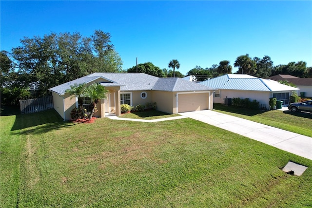 ranch-style home with a front yard, a garage, and central air condition unit