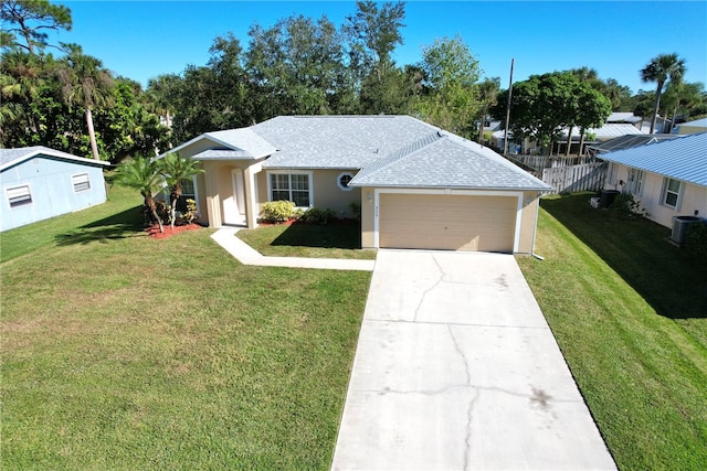 ranch-style house with central AC unit, a front yard, and a garage