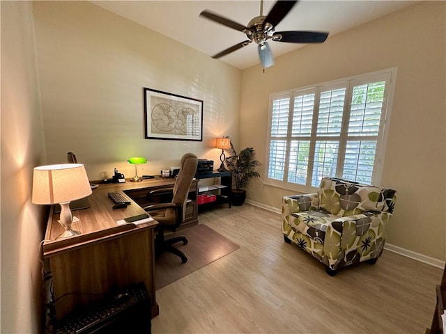 office area featuring ceiling fan, baseboards, and wood finished floors