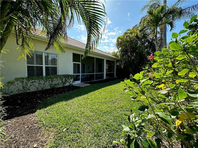 view of yard featuring a sunroom