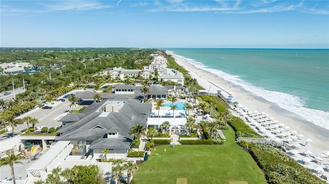 birds eye view of property featuring a view of the beach and a water view