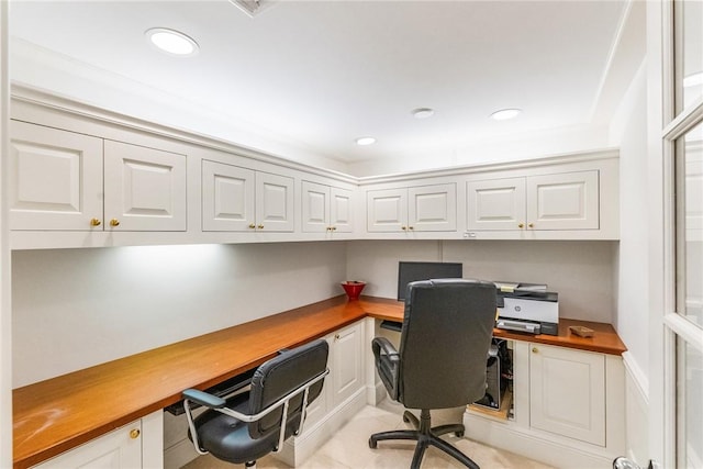 office with recessed lighting and built in desk