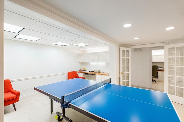 recreation room featuring baseboards, recessed lighting, french doors, and light tile patterned flooring