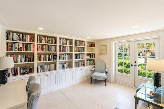 living area featuring french doors, recessed lighting, built in features, and light tile patterned flooring