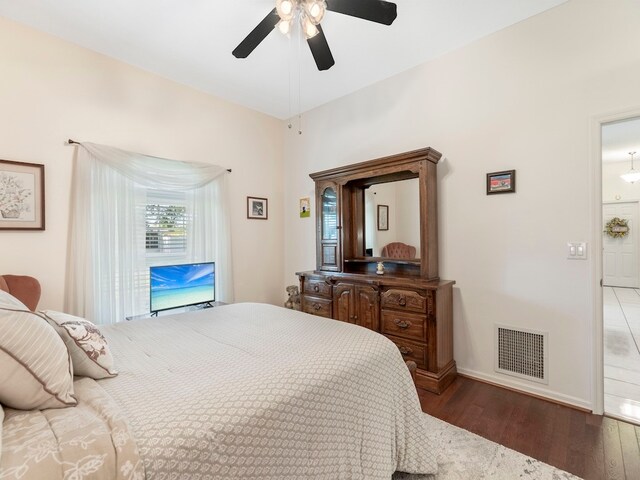 bedroom featuring dark hardwood / wood-style flooring and ceiling fan