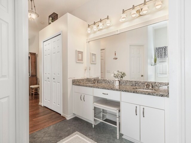 bathroom featuring vanity and wood-type flooring