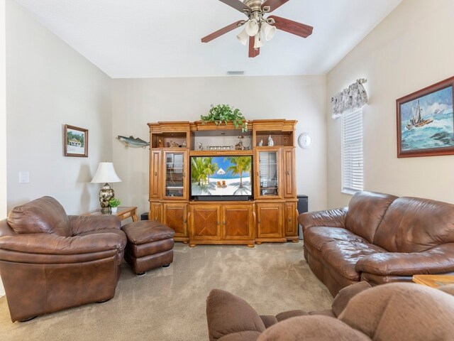 living room with light colored carpet and ceiling fan