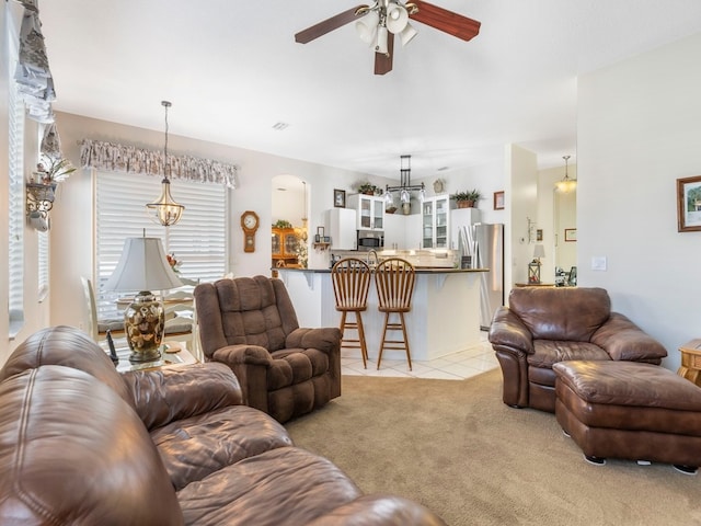 living room with ceiling fan and light carpet