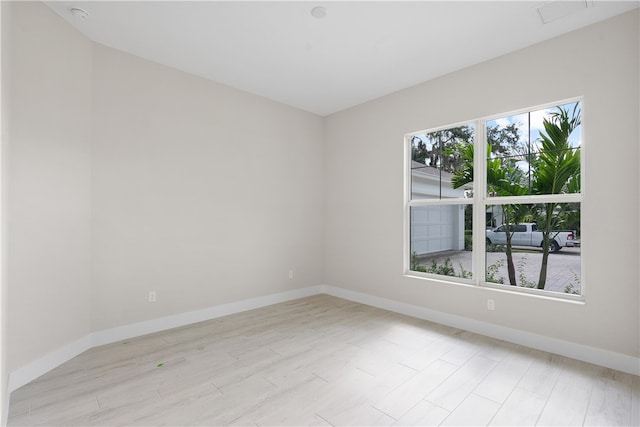 spare room featuring light hardwood / wood-style floors