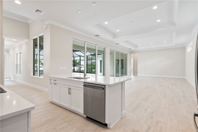 kitchen with sink, light hardwood / wood-style flooring, stainless steel dishwasher, a kitchen island with sink, and white cabinets