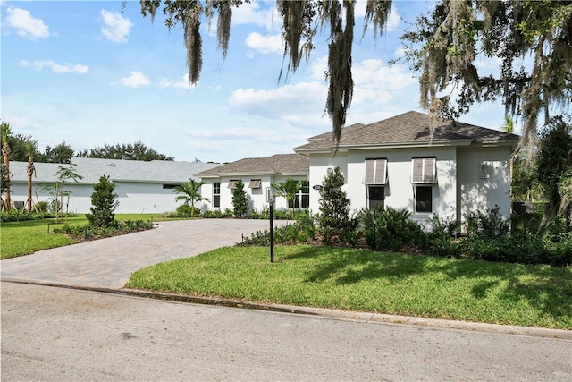 view of front of property with a front lawn