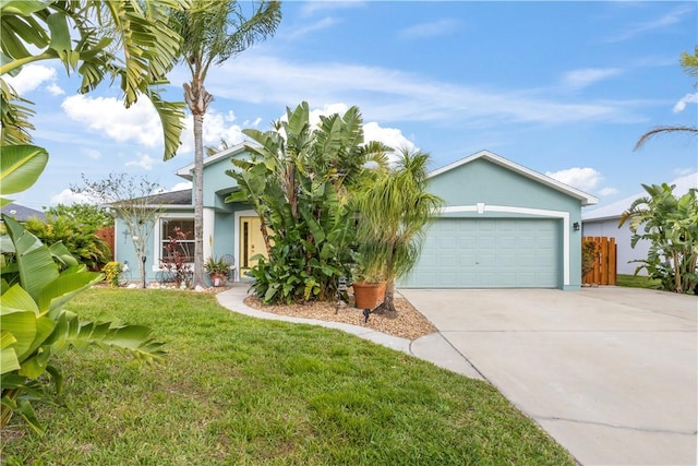 view of front of home with an attached garage, a front lawn, concrete driveway, and stucco siding