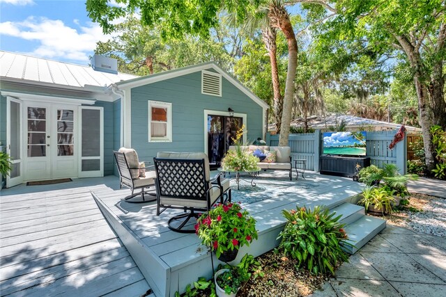 wooden deck featuring french doors