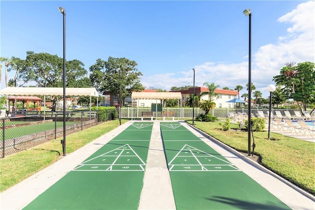 view of property's community featuring a yard