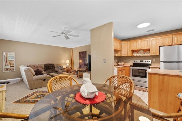 kitchen with stainless steel appliances, ceiling fan, sink, and light brown cabinetry