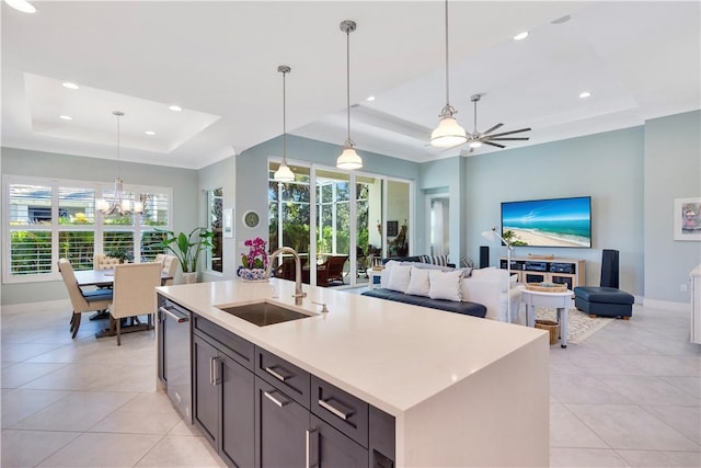 9215 Orchid Cove Cir, Vero Beach, FL 32963 - kitchen featuring a raised ceiling, a chandelier, light tile patterned flooring, plenty of natural light, and recessed lighting
