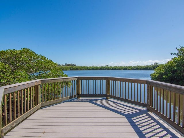 wooden deck featuring a water view