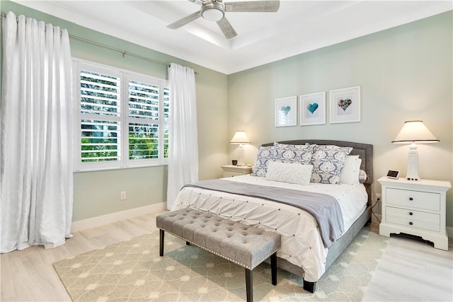 bedroom featuring light hardwood / wood-style floors and ceiling fan